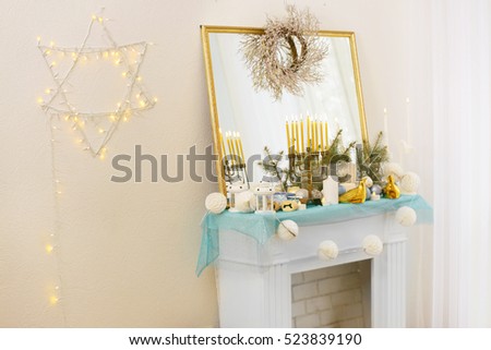 Beautiful fireplace decorated for Hanukkah