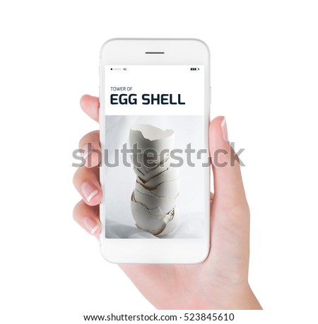 Woman using her smart phone for searching tower of egg shell on vintage background in still life photography, Food and drink concept, isolated on white background.