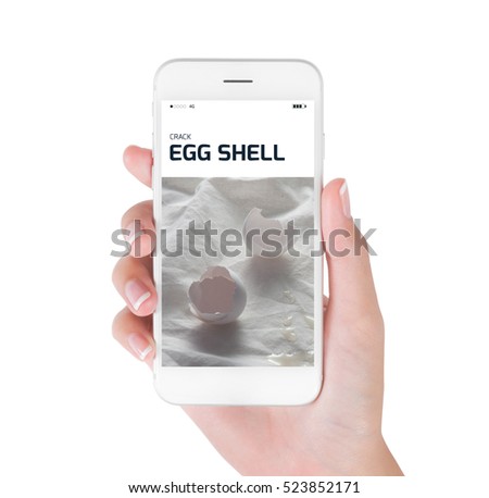 Woman using her smart phone searching crack egg shell in still life photography, Food and drink concept, isolated on white background.