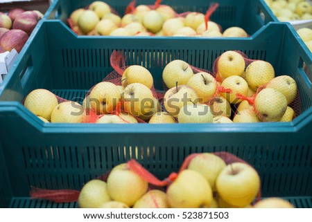 Apples in the boxes at the supermarket