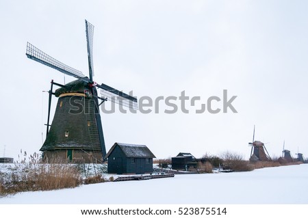 winter landscape, Windmill in snow and ice Royalty-Free Stock Photo #523875514