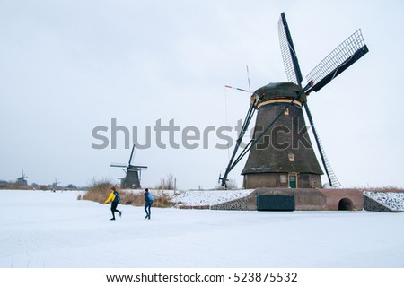 winter landscape, Windmill in snow and ice Royalty-Free Stock Photo #523875532