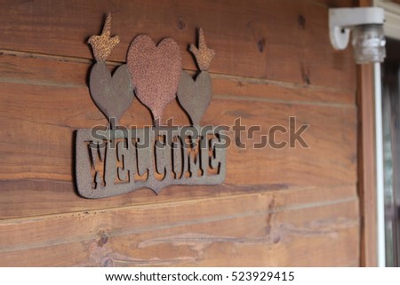 wood cabin welcome sign