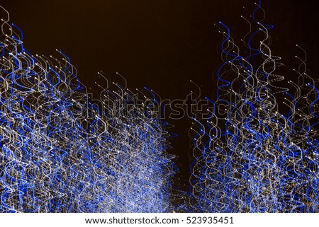Abstract background made of Christmas lights with long exposure. 
