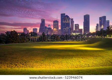 Downtown Houston at epic sunrise dawn twilight with green park lawn and modern skylines. It is the most populous city in Texas and the fourth-most in United States. Architecture and travel background.