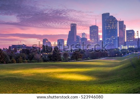 Downtown Houston at epic sunrise dawn twilight with green park lawn and modern skylines. It is the most populous city in Texas and the fourth-most in United States. Architecture and travel background.