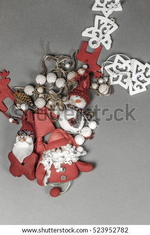 Christmas ornaments placed in smooth grey background. Copy space