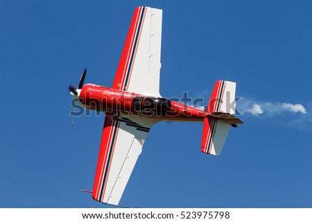 Small sports plane in the sky Royalty-Free Stock Photo #523975798