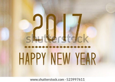 Happy New Year 2017 year on abstract blur festive bokeh background, banner, new year card Royalty-Free Stock Photo #523997611