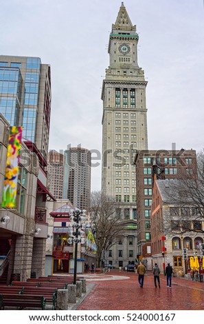 Custom House Tower and Faneuil Hall Marketplace in downtown Boston, Massachusetts, the United States. People on the background.