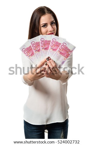 Pretty young girl taking a lot of money
