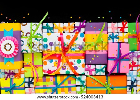 Colored gift boxes with colorful ribbons. Gifts for Christmas or a birthday.
