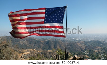American flag flying high over LA