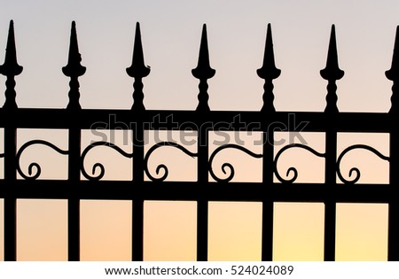 metal fence at sunset