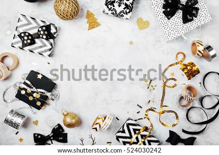 Christmas frame. Christmas gifts, bows, decor. Flat lay, top view Royalty-Free Stock Photo #524030242