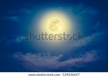 Background of nighttime sky with cloud and full moon with shiny. Natural beauty at night. Cross process and vintage effect tone.