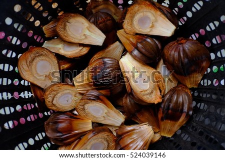 Stock Photo - Nypa palm fruit inside the busket. Malaysia known as water coconut Common South East Asia