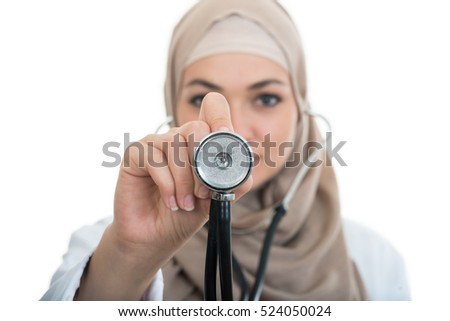 close up portrait of arab female doctor smiling while using stethoscope