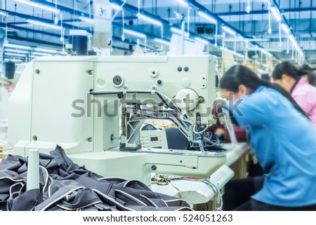 Labor force work in the garment factory Royalty-Free Stock Photo #524051263