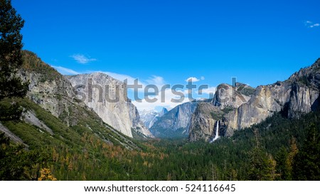 Breath taking Panoramic view of El Capitan and Bridalveil Fall at Tunnel View , Mariposa County, Yosemite National Park in the western Sierra Nevada mountains. Royalty-Free Stock Photo #524116645