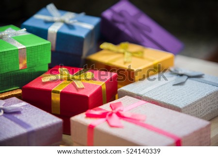 Various color of christmas&happy new year gift boxes stack, reward holiday presents greeting celebration card concept background, selective focus.