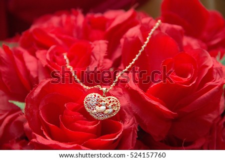 Luxury beautiful heart love necklace gold wedding and engagement on red flower background for bride