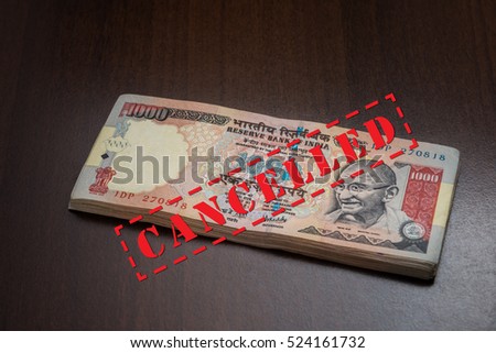 Old One thousand rupee indian currency notes with 'cancelled' stamp. Royalty-Free Stock Photo #524161732