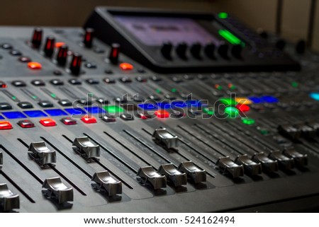 The audio equipment, control panel of digital studio mixer. Close-up, selected focus Royalty-Free Stock Photo #524162494