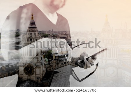 Double exposure of Designer hand with eyeglass using smart phone for mobile payments online shopping,omni channel,on white background,London architecture buildings