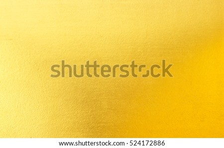 Shiny yellow leaf gold foil texture background Royalty-Free Stock Photo #524172886