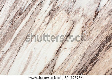 Light brown marble texture close up. High resolution photo.