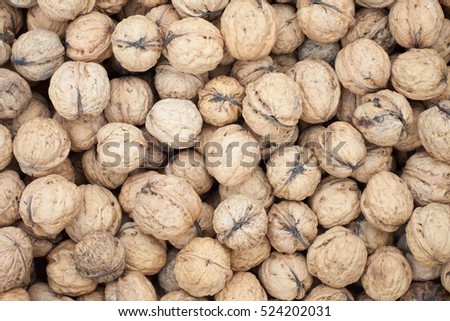 Close-up of walnuts; Brown walnuts textured background