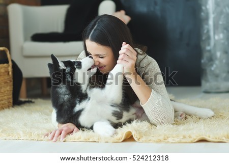 Portrait of woman with dog Royalty-Free Stock Photo #524212318