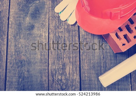 Construction tools closeup on wooden background
