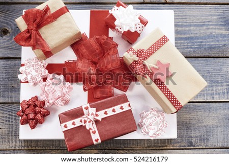 Stack of red and white Christmas gifts 