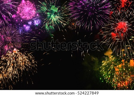 Greeting card with various colorful fireworks on black background. Multicolored Web banner. Can be used to design of holidays: Christmas, New year, anniversary, independence day, Birthday
