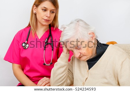 Picture of a disabled senior woman with her caregiver