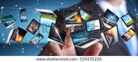 Businessman on blurred background connecting tech devices 3D rendering