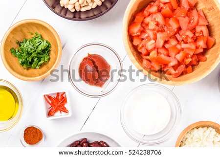 Fresh Food Ingredients On White Wood Kitchen Table