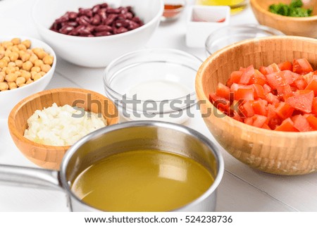 Fresh Food Ingredients On White Wood Kitchen Table