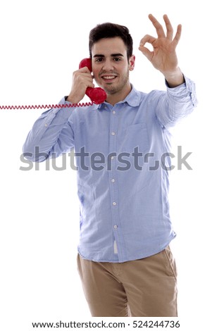young man with red phone doing ok symbol