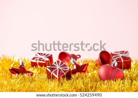 Red christmas decoration toys and  on golden background. Merry christmas card