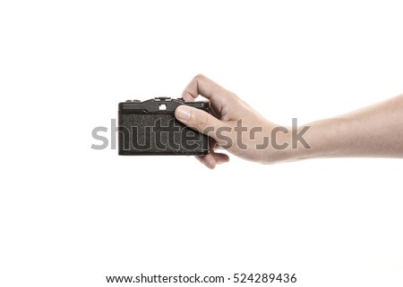 A man hand hold a vintage(old) analogue film handy camera isolated white.