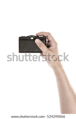 A man hand hold a vintage(old) analogue film handy camera isolated white.