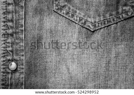 Texture jeans with studs right side on a jeans background, black and white