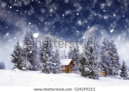 Christmas postcard with cozy cabin in heavy winter