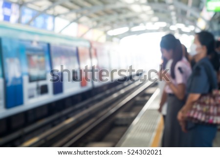 motion blur of people waiting sky train in the station
