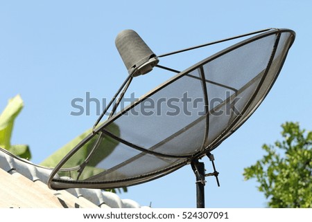 Satellite Dish on the roof and blue sky background,communication concept