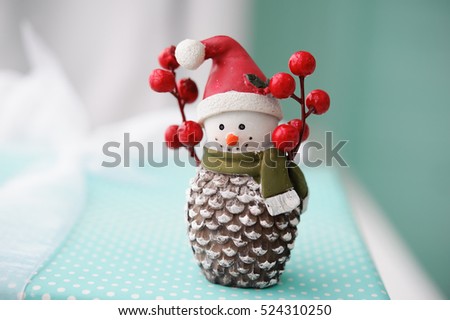 toy snowman on a red background of Christmas gifts