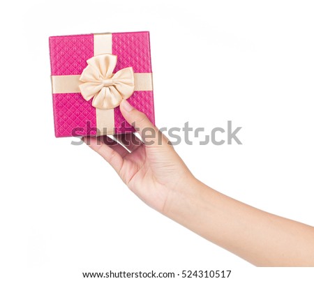 hand holding pink gift box isolated on white background